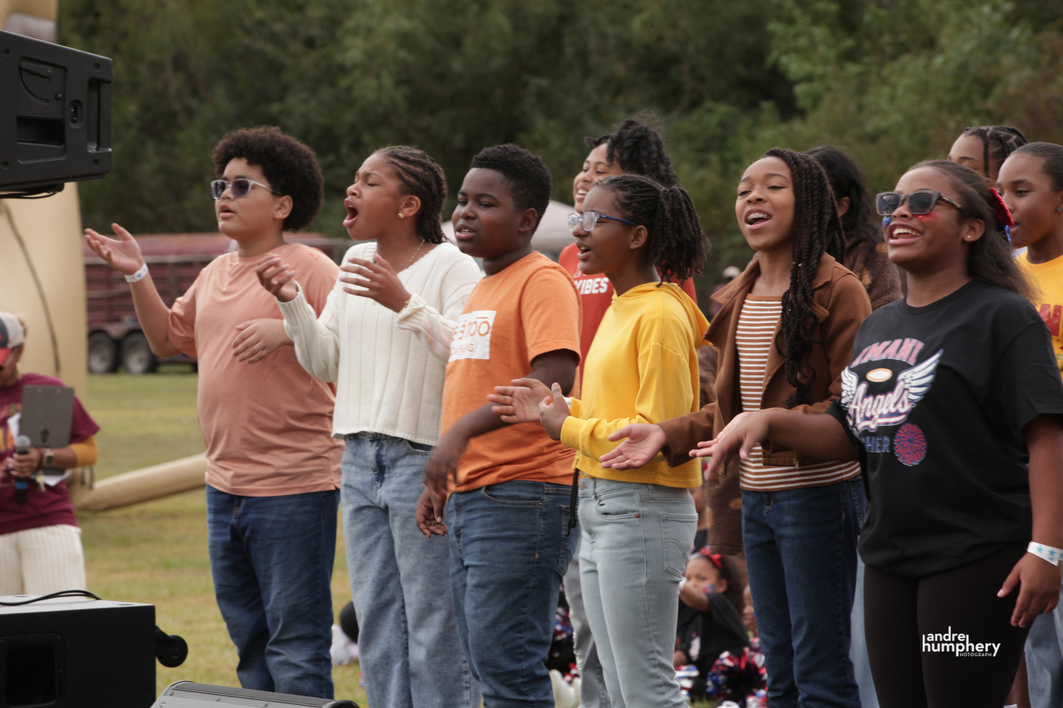 Imani students singing together on the festival stage
